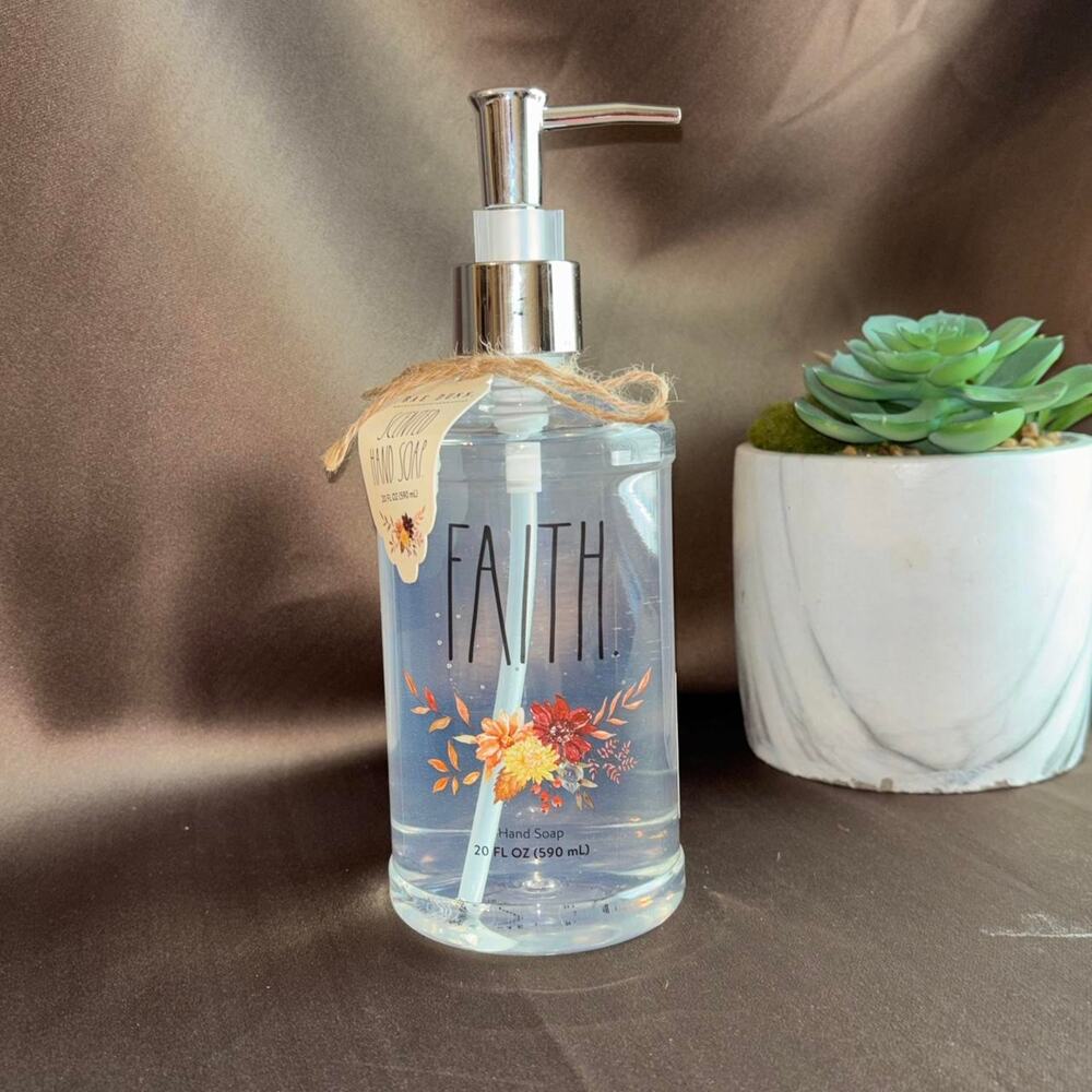 Rae Dunn White refillable soap dispenser with Calendula hand soap.'